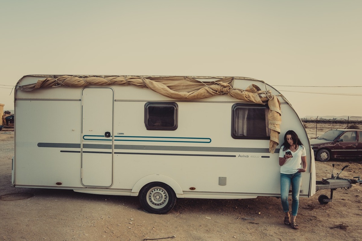 woman next to an RV