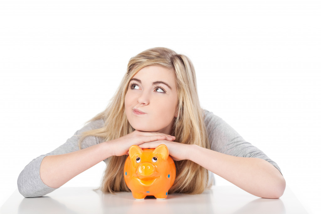 woman and piggy bank